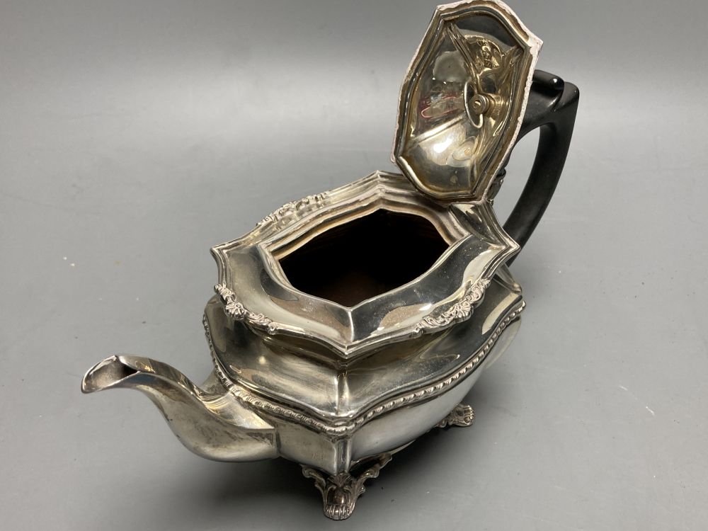A George V silver bachelors three piece tea set, Josiah Williams & Co, London, 1913 and a silver pickle fork,